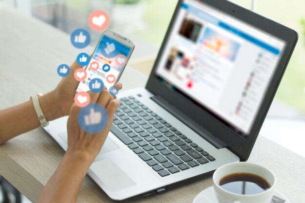 Young,Woman,Using,Smart,Phone,social,Media,Concept. Social Media Marketing Dos and Don’ts for Small Businesses