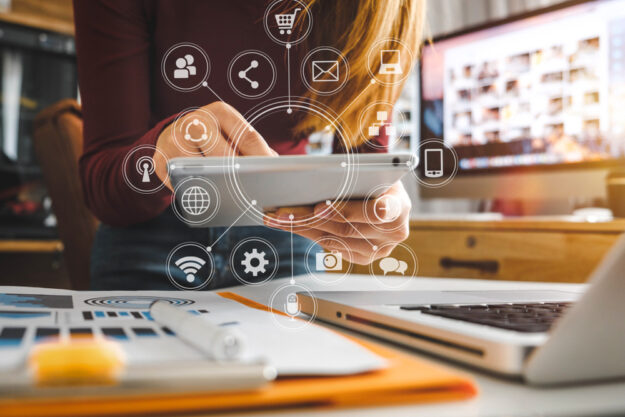 Businesswoman,Hand,Working,With,Laptop,Computer,,Tablet,And,Smart,Phone Twelve Digital Marketing Trends for 2022 and How to Take Advantage of Them