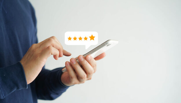 Close,Up,On,Customer,Man,Hand,Pressing,On,Smartphone,Screen The Key to Engaging Your Customer Base