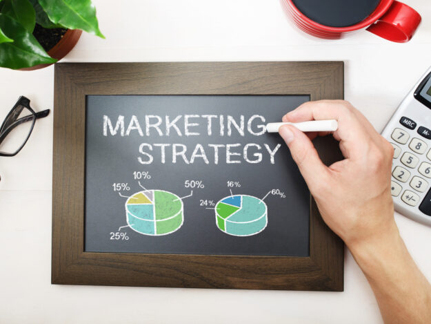 Marketing,Strategy,Sketched,On,A,Little,Black,Chalkboard